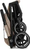 A folded beige and black stroller is shown against a white background. Anteprima dell’immagine prodotto