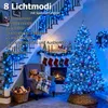 A Christmas-decorated staircase and living room with blue LED string lights. Produktbild-Vorschau