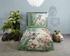 A bedroom scene with a duvet cover featuring jungle animals, plants, and decorative wall art. Anteprima dell’immagine prodotto