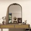 A vanity table with a decorative mirror and various beauty products. Podgląd zdjęcia produktu