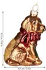 A glass Christmas ornament shaped like a golden retriever dog wearing a red bow, with glitter accents. Dimensions are shown with measurement lines and text. Náhled obrázku produktu