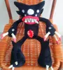 A black plush toy monster sitting on a wicker chair. Produktbild-Vorschau