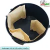 A black vacuum cleaner bin with paper dust bags inside, viewed from above. Produktbild-Vorschau