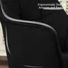 Close-up of a black upholstered chair armrest and backrest, highlighting its ergonomic design. Produktbild-Vorschau
