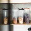 Several clear plastic food storage containers filled with cereal are neatly arranged on a shelf. Produktbild-Vorschau