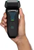 A hand holding a black Remington F6 Wet/Dry electric shaver. Anteprima dell’immagine prodotto