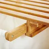 A close-up view of the bamboo construction of a laundry basket shelf. Anteprima dell’immagine prodotto