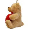 A teddy bear holding a red heart. Anteprima dell’immagine prodotto
