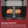 Close-up of an air fryer with french fries inside, with descriptive text below. Produktbild-Vorschau