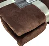 A folded brown microfiber blanket with a ribbon and tag. Náhled obrázku produktu