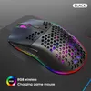 A black wireless gaming mouse with RGB lighting is displayed on a dark surface, possibly a mousepad. Podgląd zdjęcia produktu