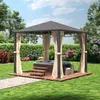 A gazebo with a hot tub inside, set in a garden with lush green grass and flowering bushes. Produktbild-Vorschau