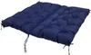 A dark blue tufted bench cushion with ties. Produktbild-Vorschau