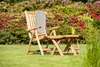 A wooden garden chair with a blanket and a drink in a garden setting. Produktbild-Vorschau