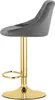 A side view of a gray velvet bar stool with a gold base. Voir les images du produit
