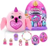 A collection of Rainbocorns Eggzania Surprise Mania toys, including a large plush toy, a large egg, and several smaller surprise eggs and accessories. Náhled obrázku produktu