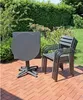 An outdoor patio setting with a table and chairs. Produktbild-Vorschau