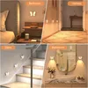 Collage of four images showing LED night lights in different home settings: bedroom, hallway, stairs, and bathroom. Produktbild-Vorschau