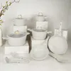 A collection of cookware and utensils arranged on decorative blocks. Náhled obrázku produktu