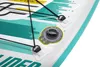 A close-up view of the deck of an inflatable stand-up paddleboard, showing bungee cords, attachment points, and an inflation valve. Produktbild-Vorschau