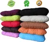 A stack of colorful, rectangular cushions. Anteprima dell’immagine prodotto