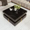 A modern black coffee table with gold accents is placed in a living room setting, next to a sofa and on a patterned rug. Náhled obrázku produktu