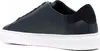 A side view of a dark blue sneaker with a white sole. Produktbild-Vorschau