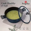 A dark blue pot with a glass lid filled with a light green soup is shown on a light gray placemat. Text overlays promote healthy and safe cooking. Anteprima dell’immagine prodotto