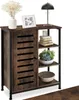 A wooden sideboard with black metal accents, decorated with a vase of flowers, a framed picture, a lamp, books, a plant, and a bowl. Náhled obrázku produktu
