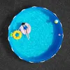 Draufsicht auf den Nadelfilz Bodenbelag unter einem Aufstellpool Produktbild-Vorschau