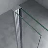 Close-up of a shower door frame and glass panels against a concrete wall. Produktbild-Vorschau