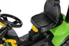 Close-up view of the seat and steering wheel of a toy tractor. Produktbild-Vorschau