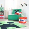 A Minecraft-themed room setup with a chair, rug, storage cubes, and a side table. Produktbild-Vorschau