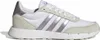 A side view of a white Adidas sneaker with silver stripes and tan accents. Produktbild-Vorschau