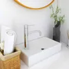 A modern bathroom sink with a chrome faucet and a rolled towel in a basket. Náhľad obrázku produktu