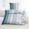 A neatly made bed with a duvet and pillow, showcasing bedding with a striped and feather pattern. Produktbild-Vorschau