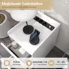 A white nightstand with a built-in charging station, featuring a lamp, a phone on a wireless charger, and a drawer. Produktbild-Vorschau