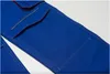 A close-up view of the pocket and stitching on a pair of blue work pants. Produktbild-Vorschau