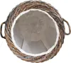 A top-down view of a round laundry basket made of woven rattan with a white fabric liner. Produktbild-Vorschau