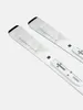 A pair of white skis with black tips and bindings, shown from a diagonal angle against a white background. Voir les images du produit