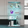 A glass display cabinet with LED lighting, showcasing various collectible items and books. Podgląd zdjęcia produktu