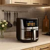 An air fryer is placed on a kitchen countertop. Produktbild-Vorschau