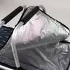A close-up view of the interior of an open insulated picnic basket, showing the silver lining and the black handles. Náhled obrázku produktu