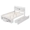 A white wooden bed frame with storage drawers and a headboard with built-in shelves and USB ports. Anteprima dell’immagine prodotto