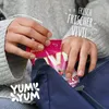 Hands are taking a bag of candies out of a blue bag. Produktbild-Vorschau