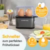 A GOURMETmaxx egg cooker is shown on a kitchen counter with eggs inside and an egg cup with a cooked egg next to it. There are also breakfast items and juice in the background. Text overlays highlight features and benefits. Náhled obrázku produktu