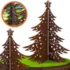 Two 3D Christmas trees made of rusted metal with star cutouts, placed on a simulated grassy mound. Voir les images du produit