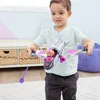 A young boy is playing with a toy airplane. Náhľad obrázku produktu