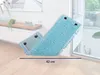A blue mop head is shown on a wooden floor, leaning against a white wall near a window. Produktbild-Vorschau