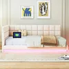 A beige upholstered daybed with LED lighting underneath, set in a room with two framed art pieces on the wall. Produktbild-Vorschau